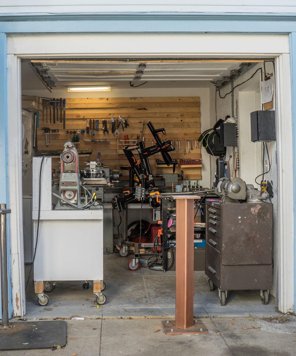 The open garage door of the Oakland frame shop